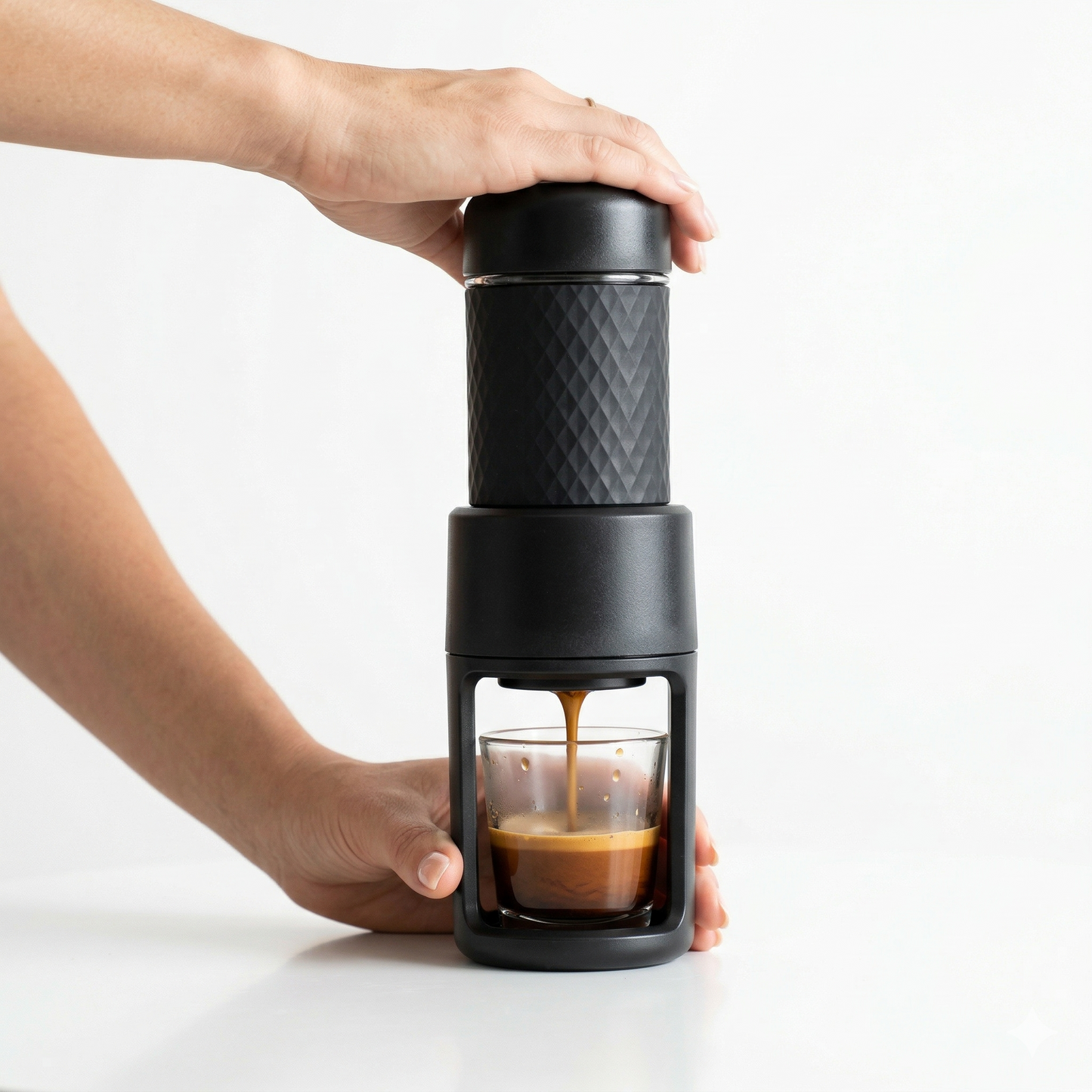 small portable manual espresso coffee machine fitting easily into bag for travel use